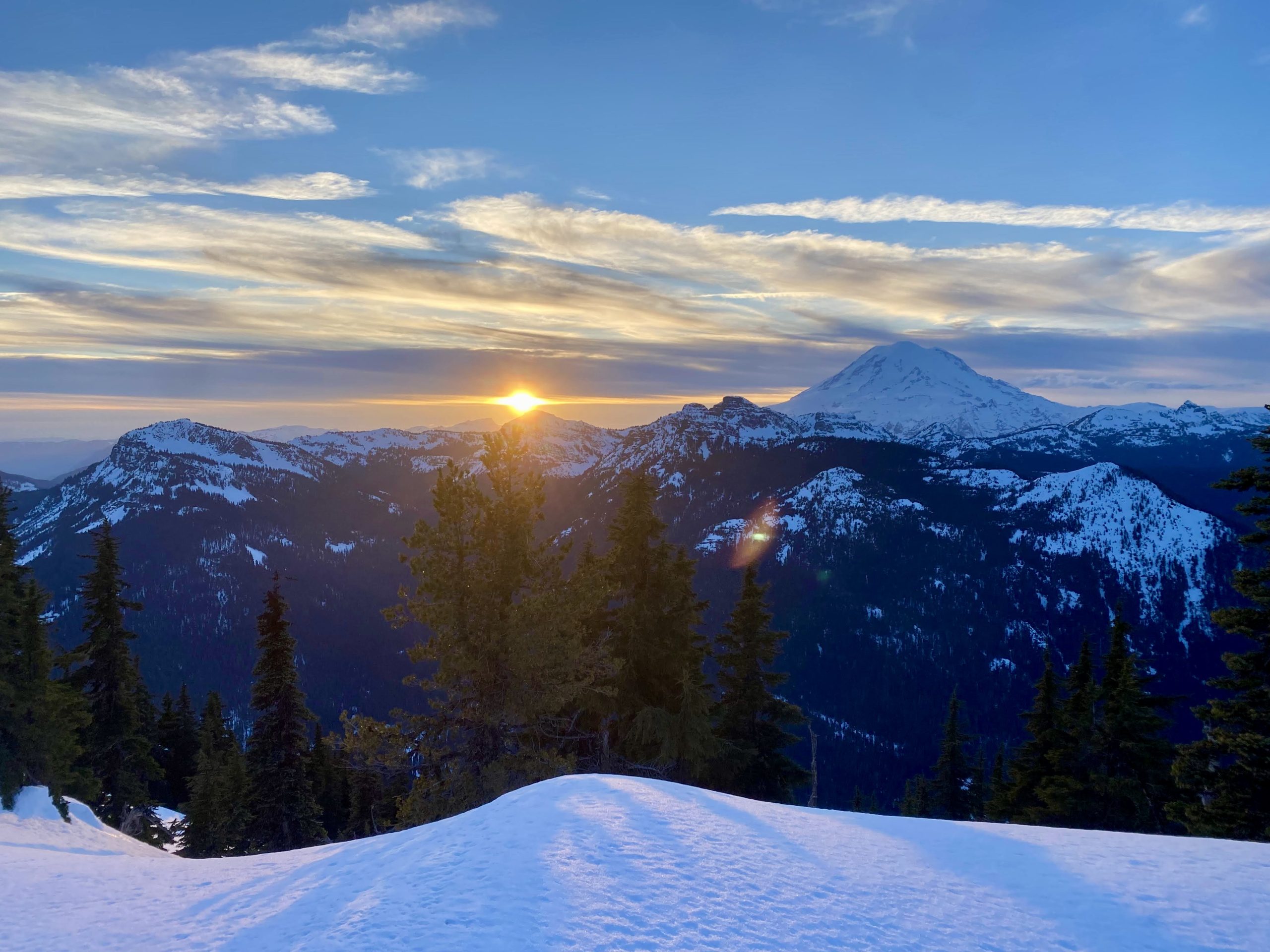 Sun sets over the snowy Cascades